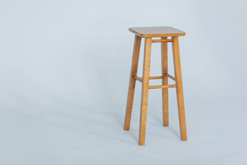 Bar stool with is an empty white room on a white background