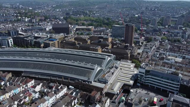 Aerial View of Brighton Railway Station revealing City and Downs on a Sunny day.