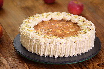 Homemade apple pudding cake with whipping cream