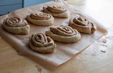 uncooked cinnamon buns decorated with granulated sugar