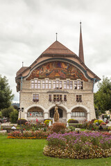 Fototapeta na wymiar City hall of Le Locle, Switzerland. In front very beautiful garden.