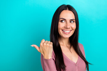 Fototapeta premium Portrait of satisfied adorable woman pastel clothes look directing at discount empty space isolated on shine turquoise color background
