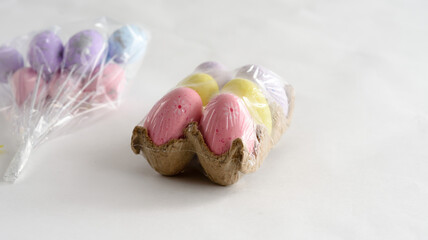 Easter colored eggs on a light background