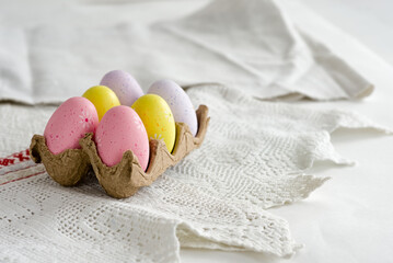 Fototapeta na wymiar Easter colored eggs on a light background