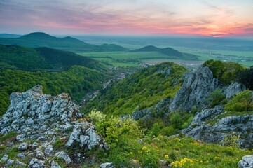 Naklejka premium Dramatic spring sunrise in beautiful nature landscape - mountain panorama. Mountainous rural landscape in spring morning. 