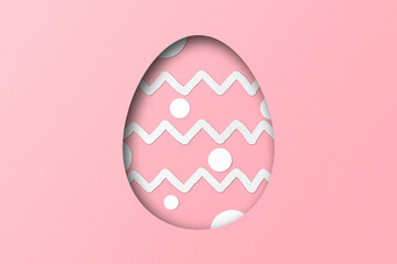 Pink paper cut to form an Easter egg pattern.