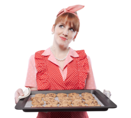 Happy vintage style housewife holding freshly baked cookies