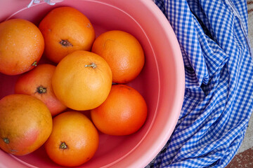 large quantities of large grapefruits in a large bowl,close-up grapefruit fruit,