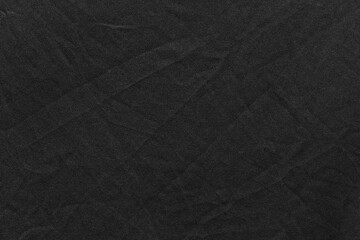 Black color sports clothing fabric football shirt jersey texture and textile background.