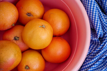 large quantities of large grapefruits in a large bowl,close-up grapefruit fruit,