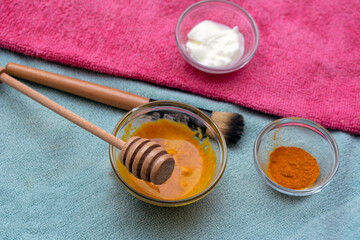 Homemade face mask with turmeric, yoghurt, coconut oil and honey for uneven skin tone, brightening dark spots and reducing fine wrinkles in diy beauty