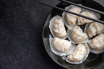 dumplings dim sum rice flour dough Chinese food meal snack on the table copy space food background...