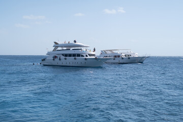 Fototapeta na wymiar Beautiful white private motor yacht for a boat trip on the Red Sea, Egypt