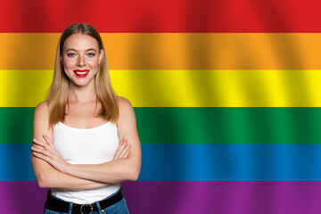 Beautiful happy woman smiling on the background of Lgbt flag. Freedom, support, rights concept