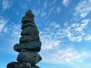 Pyramid of stones against the sky, the concept of balance. © tasha