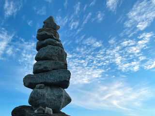 Pyramid of stones against the sky, the concept of balance.