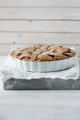 Classic Linzer cake on white wooden background close up selective focus 