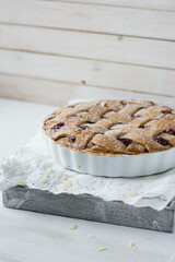 Classic Linzer cake on white wooden background close up selective focus 