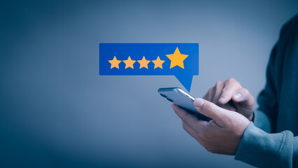 man using smartphone rating extremely satisfied with star icon Show quality assessment high satisfaction received from excellent service or product, satisfaction survey concept and customer service