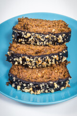 Pastry made of zucchini with nuts and raisin. Delicious dessert. White background
