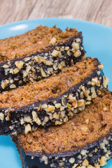 Pastry made of zucchini with nuts and raisin on plate. Delicious dessert