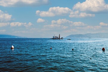 a fishing boat fishing in the middle of the sea