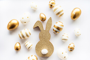 easter bunny and golden eggs isolated on white background. Happy Easter minimal concept, greeting card. soft selective focus.