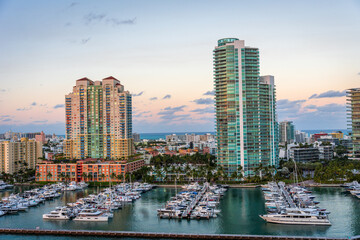 Marina in Miami Beach with the Miami skyline in the background at sunset