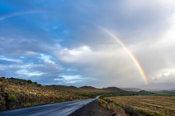 A rainbow after a Karoo storm along the N12 just outside Klaarstroom. Western Cape. South Africa