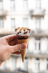 ice cream cone in male hand