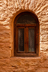 Fototapeta na wymiar Wooden window in wall in Agadir, Morocco