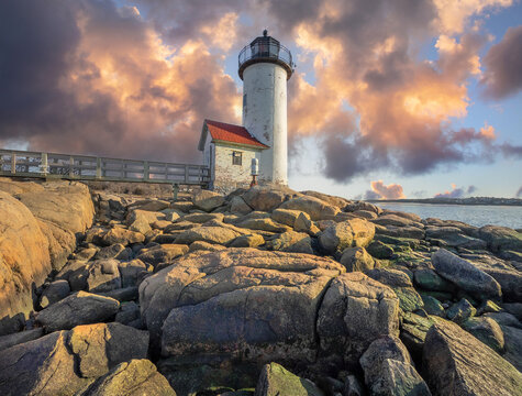 Anisquam light house at sunset off the coast of Gloucester, MA. USA