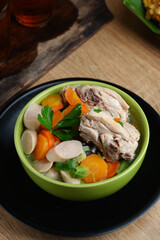 homemade chicken soup with vegetables, served in bowl