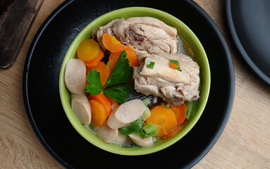 homemade chicken soup with vegetables, served in bowl