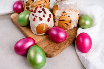 Easter cruffin cake and colored green and red Easter eggs 