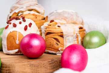 Easter cruffin cake and colored green and red Easter eggs 