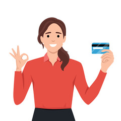 Financial stability and credit card concept. Young smiling asian woman holding golden credit card in raised hand showing ok sign gesture