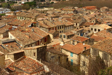 Obraz premium View of the ancient town of Sommières, Gard, Occitania, France. Top down view of small roman town in South of France with typical Mediterranean terra cotta roofs