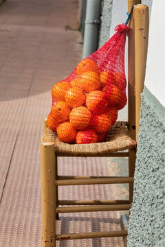 Fresh Oranges in a Net for Sale - Local Street Market in Oropesa del Mar, Spain