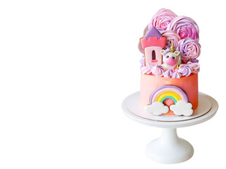Cute pink birthday cake for a little girl with fondant unicorn, with gingerbread cookies isolated on white background, horizontal orientation