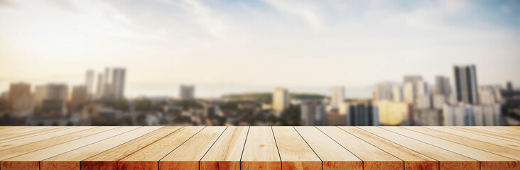 Wood table top on white bokeh blurred city sunset background building hallway for display or...