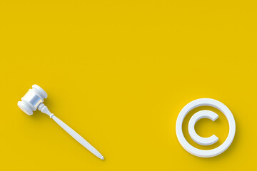Copyright symbol and judge hammer at corners. Intellectual property concept. Top view. Copy space. 3d render