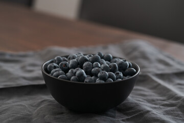 big bowl with blueberries on table