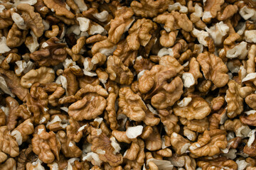 Selective focus. Peeled walnut kernels. Background from walnut kernels. Peeled walnuts.