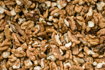 Selective focus. Peeled walnut kernels. Background from walnut kernels. Peeled walnuts.