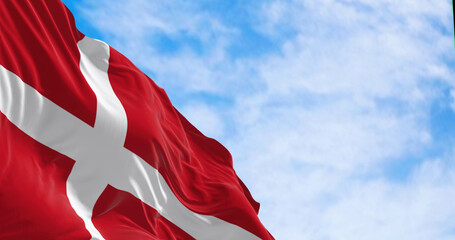 Denmark national flag waving in the wind on a clear day. - obrazy, fototapety, plakaty