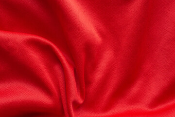 Red sports clothing fabric football shirt jersey texture background