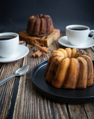 Delicious dessert, dark chocolate cake. On a wooden background