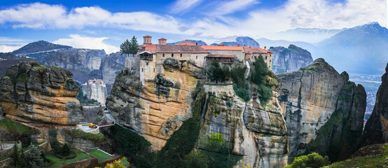 Mysterious monasteries hanging over rocks of Meteora, Greece - most famous landmarks and beautiful places - obrazy, fototapety, plakaty