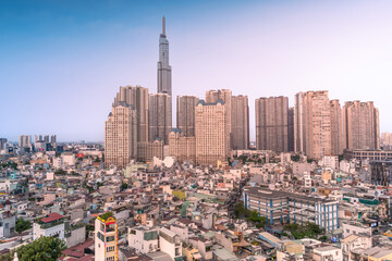Fototapeta na wymiar Aerial view of Landmark 81 skyscraper, buildings, roads, houses and Saigon elevated railway line. Travel concept.